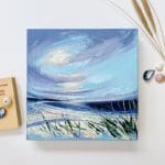 A Spiritual Freedom - Coastal view. Sweep of the beach and tidal patterns along the shoreline, looking out to sea. Dramatic early evening sky